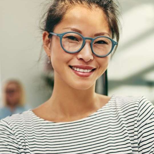 young-asian-businesswoman-smiling-confidently-in-a-4H6MSAK-small.jpg